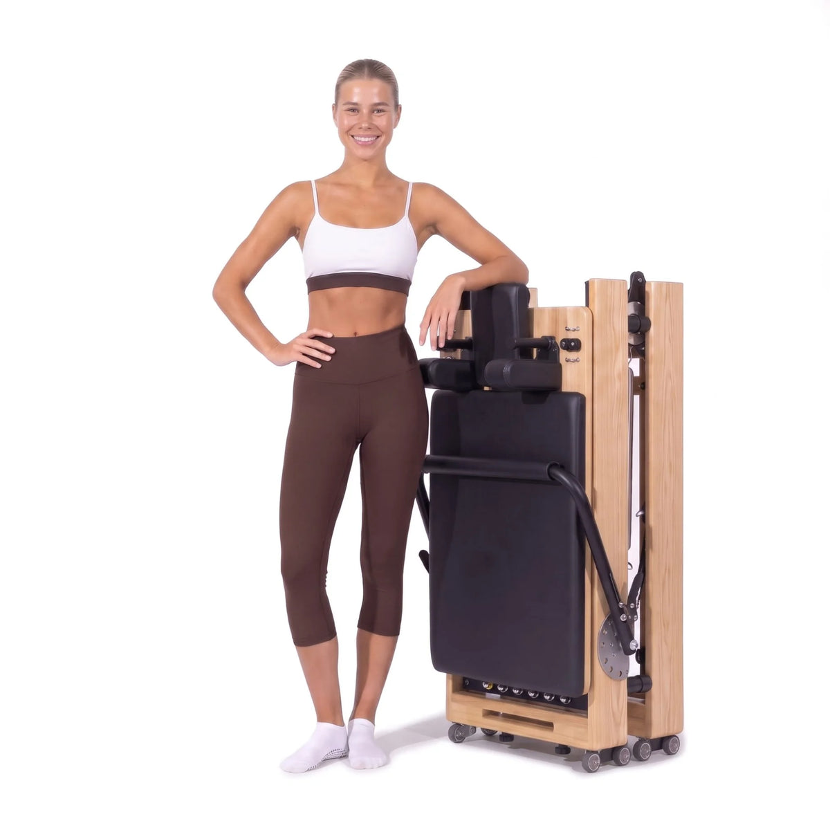 Foldable Pilates reformer Flexi black, stored upright