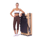 Foldable Pilates reformer Flexi black, stored upright
