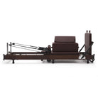 Foldable Pilates reformer Flexi espresso wine, side view with sitting box