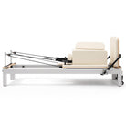 Pilates reformer aluminum milky white, side view with sitting box