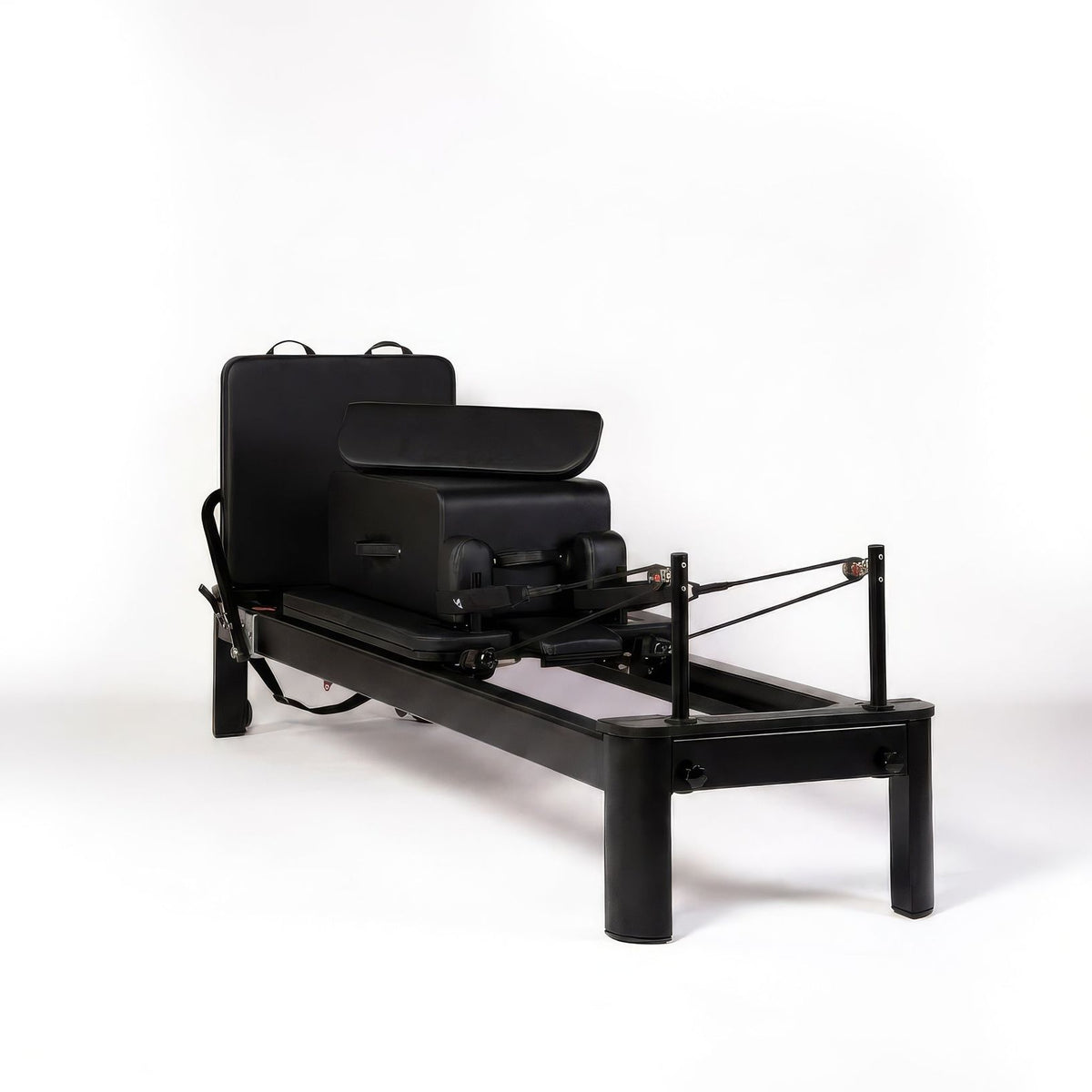 Pilates reformer aluminum total black, 3/4 view with sitting box