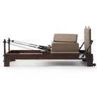 Pilates reformer Prestige taupe, side view with sitting box